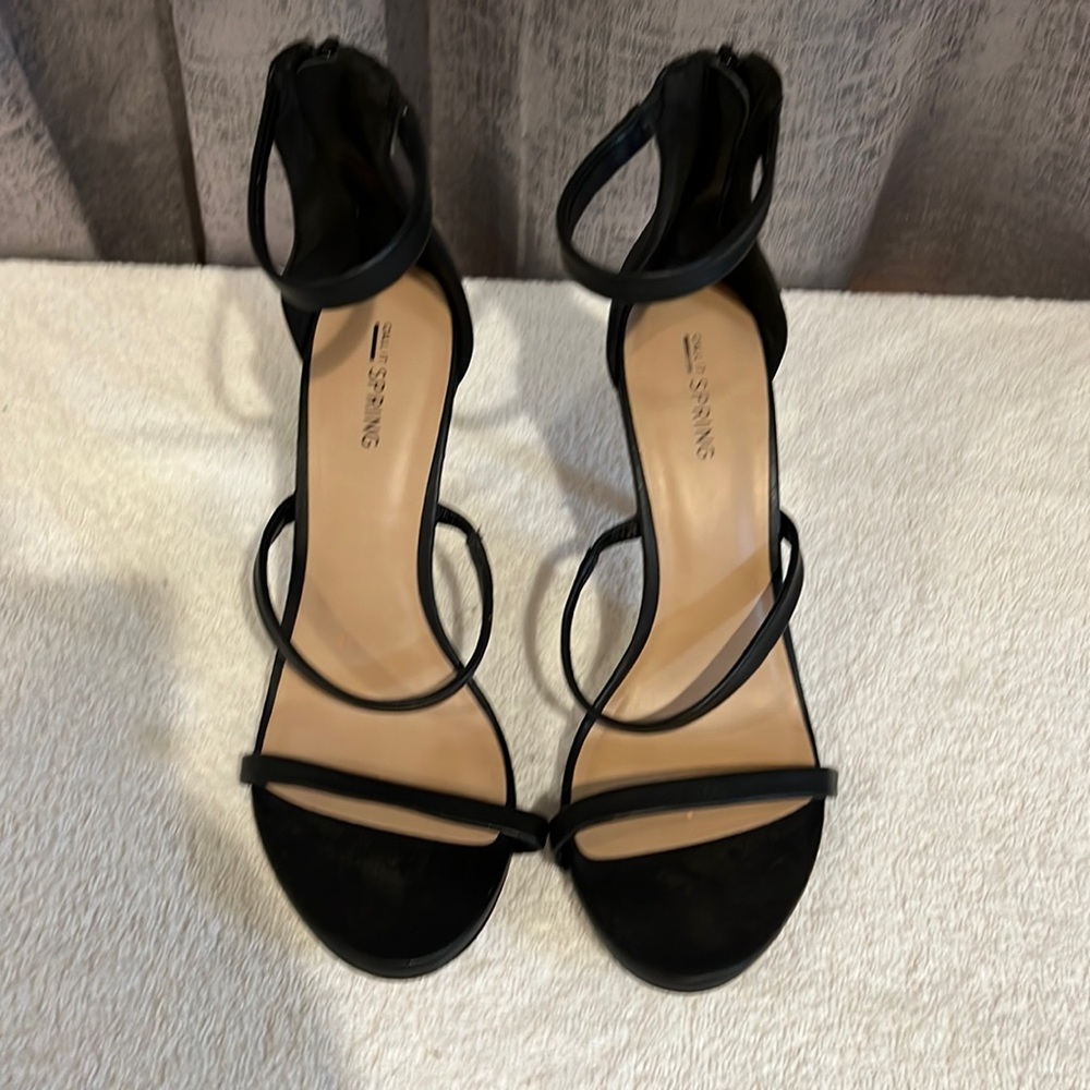 Size 10  black leather  brand is Call it spring heels